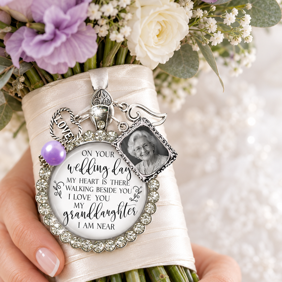 Silver bridal bouquet photo charm with granddaughter wedding memorial quote and angel wing on bridal flowers.