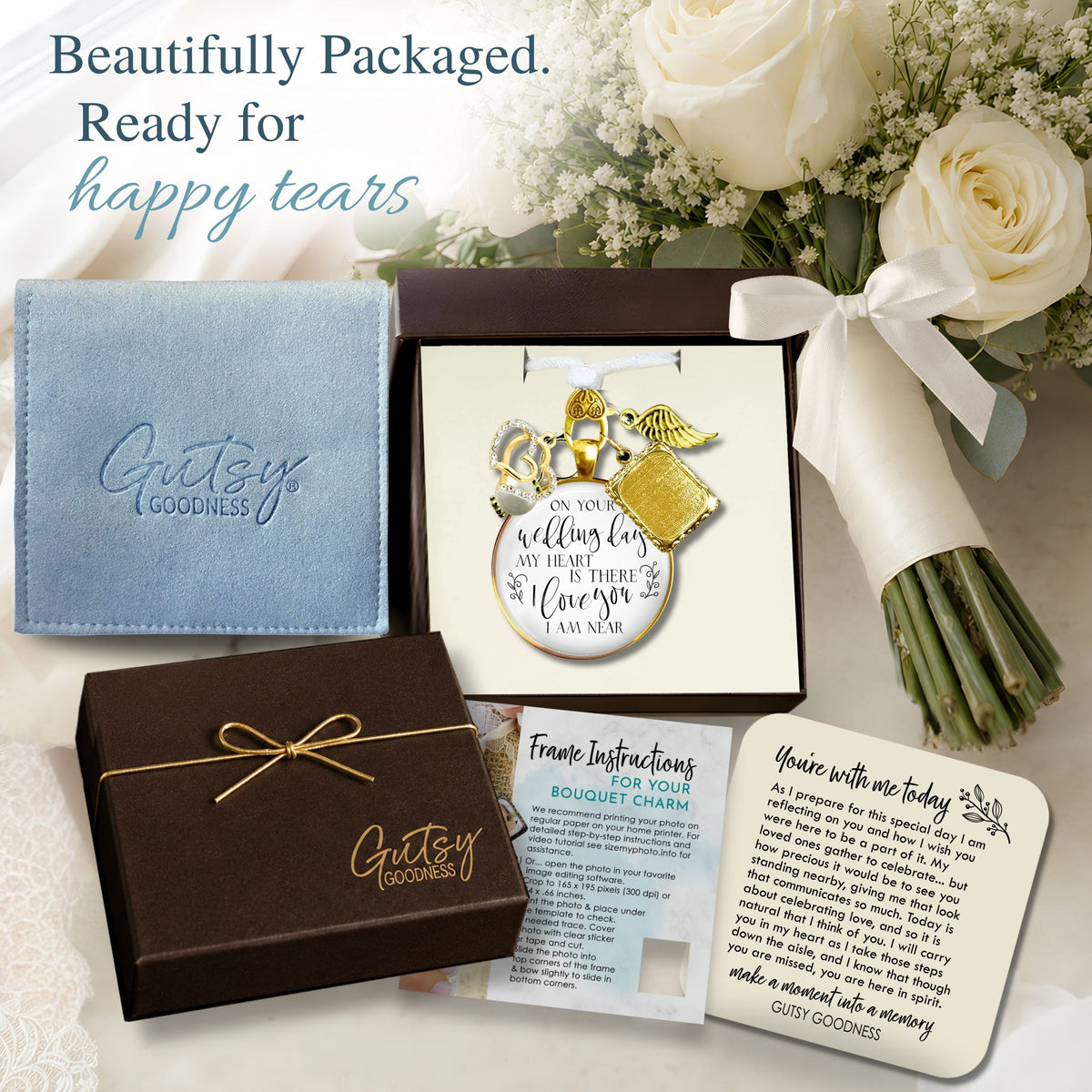 Gutsy Goodness gold bridal bouquet memorial charm gift packaging, featuring an espresso keepsake box tied with gold cord, light blue jewelry pouch, bouquet charm instruction guide, and sentimental "You're with me today" keepsake card beside white wedding roses with headline "Beautifully Packaged. Ready for happy tears."
